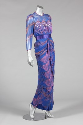 Lot 134 - A Zandra Rhodes printed blue chiffon evening...