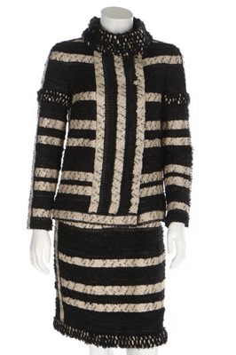 Lot 40 - A Chanel striped tweed suit, Pre-Fall 2009,...