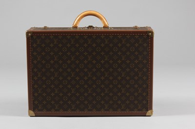 Lot 19 - A Louis Vuitton hard-sided suitcase, with...