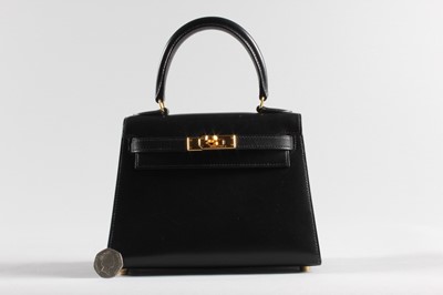Lot 27 - An Hermès black box-calf leather miniature...