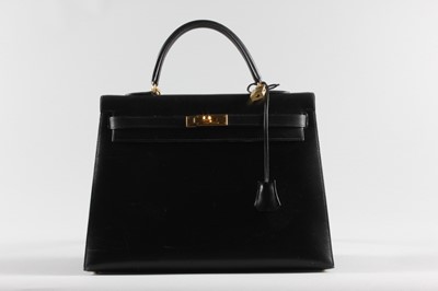 Lot 21 - An Hermès black box calf leather Kelly bag,...
