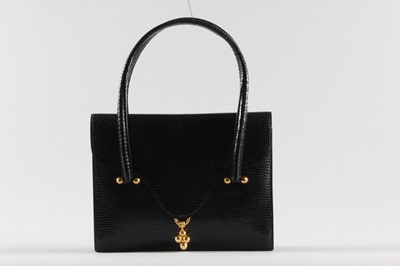 Lot 24 - An Hermès black lizard handbag, late 1960s,...