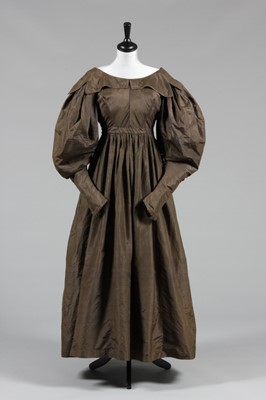 Lot 43 - A brown taffeta dress, circa 1835, with gigot...
