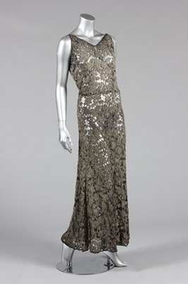 Lot 60 - A beaded cutwork organza evening gown, circa...