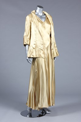 Lot 64 - A fine and important Chanel couture gold satin...