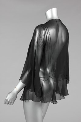 Lot 61 - A Chanel couture black chiffon evening jacket...