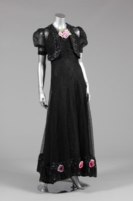 Lot 86 - A black lace and cir (wet look) rayon evening...