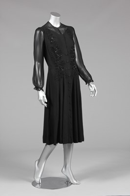 Lot 83 - An Agnes-Drecoll couture black crpe dinner...