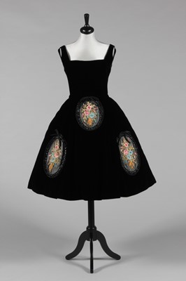 Lot 87 - A black velvet cocktail dress, attributed to...
