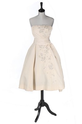 Lot 143 - A Pierre Balmain ivory faille cocktail dress,...
