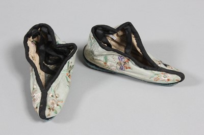 Lot 336 - A pair of embroidered blue damask silk shoes...