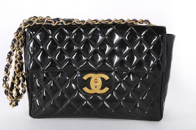 Lot 16 - A Chanel patent leather jumbo flap bag,...