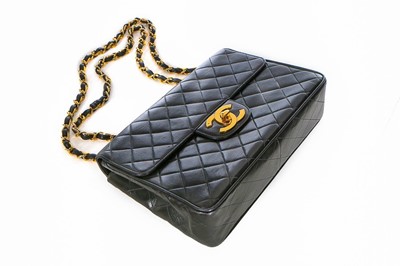 Lot 11 - A Chanel quilted leather jumbo flap bag, late...