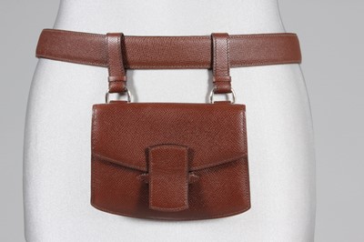 Lot 69 - An Hermès brown leather belt with pouch,...