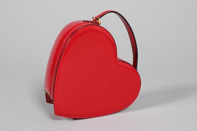 Lot 70 - A Moschino red leather heart bag, probably...