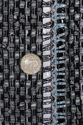 Lot 47 - A Chanel silver tweed ensemble trimmed with...