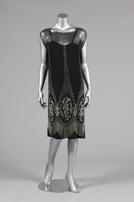 Lot 1 - A black beaded chiffon flapper dress, circa...