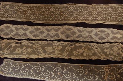Lot 443 - A Mechlin lappet, circa 1760-70, of ivory silk,...