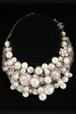 Lot 19 - A Chanel faux pearl and 14ct white gold chain...