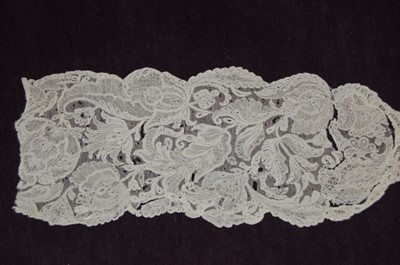 Lot 448 - A broad fragment of Reseau Venise needlepoint,...