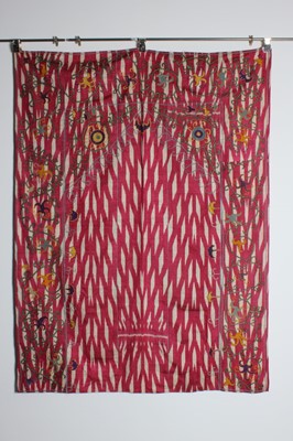 Lot 389 - A pink and white ikat silk panel embroidered...