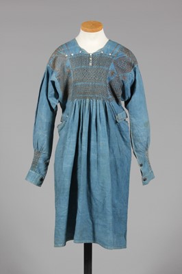 Lot 9 - A blue calico farmer's smock, circa 1900,...