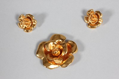 Lot 29 - A Chanel camelia brooch and pair of matching...
