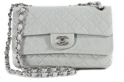 Lot 22 - A Chanel eau-de-nil quilted leather double...
