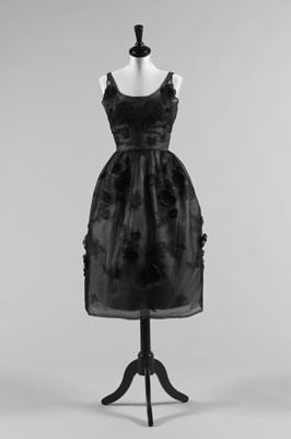 Lot 121 - A John Cavanagh couture black organza cocktail...