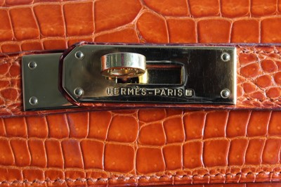 Lot 13 - A fine Hermès orange crocodile Kelly bag, 1995,...