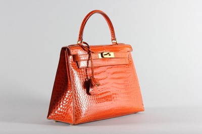 Lot 13 - A fine Hermès orange crocodile Kelly bag, 1995,...