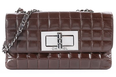Lot 23 - A Chanel quilted chocolate brown leather bag,...