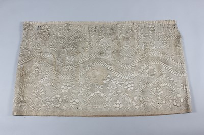 Lot 30 - A quilted ivory satin petticoat, second half...