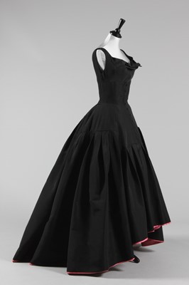 Lot 84 - A Pierre Balmain black faille ball gown, circa...