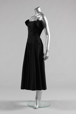 Lot 98 - A Jean Dessès designed black wool dress, early...