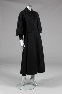 Lot 194 - An Yves Saint Laurent black wool redingote,...