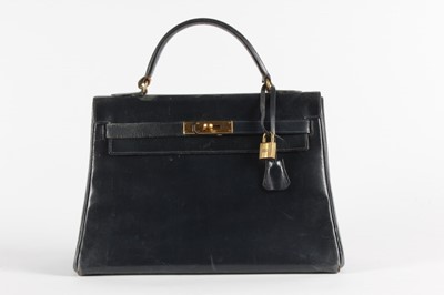 Lot 16 - An Hermès navy leather Kelly bag, 1960s,...