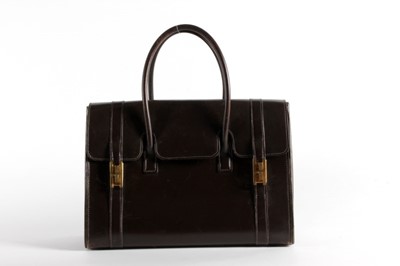 Lot 31 - An Hermès brown leather Drag bag, 1960s,...
