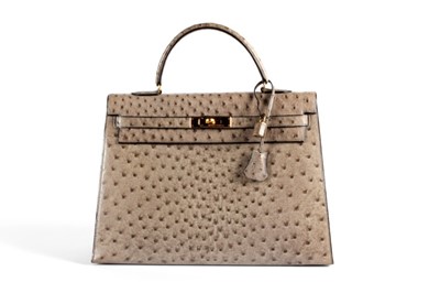 Lot 7 - An Hermès grey-brown ostrich leather Kelly bag,...