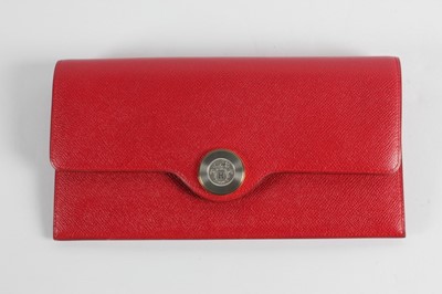 Lot 23 - An Hermès red epsom leather clutch bag, 1992,...