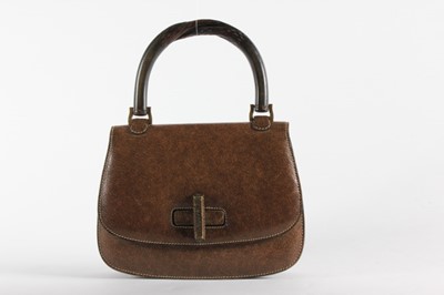 Lot 32 - A Gucci brown pigskin handbag with carved bent-...