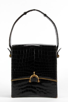 Lot 20 - A rare 'Eperon' Hermès black crocodile handbag,...