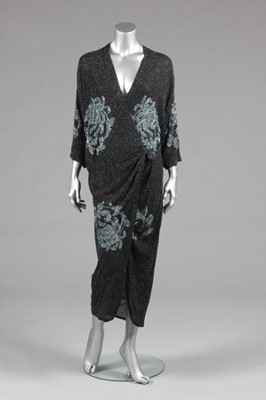 Lot 71 - A beaded opera coat, mid 1920s, the black...