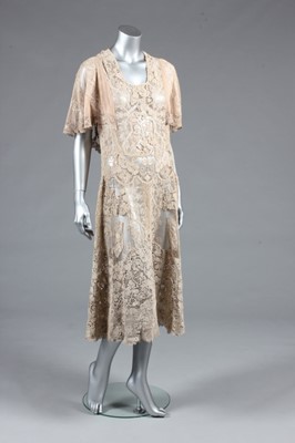 Lot 84 - A 1930s summer gown formed of Edwardian lace,...