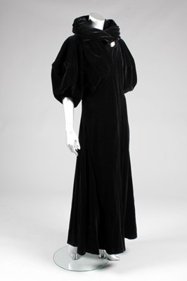 Lot 82 - A Madeleine Vionnet black velvet evening coat,...