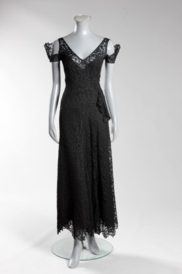 Lot 89 - A Chanel couture black lace evening gown,...