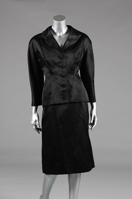 Lot 96 - A Balenciaga couture black satin cocktail suit,...