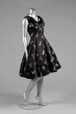 Lot 111 - A Jacques Heim couture oriental brocaded satin...