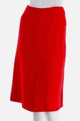 Lot 140 - A Chanel couture bright red tweed suit, 1974,...