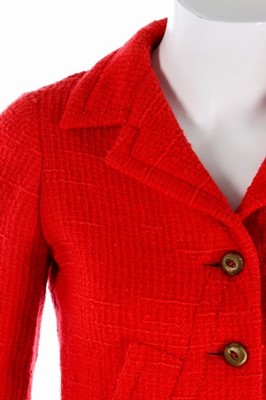 Lot 140 - A Chanel couture bright red tweed suit, 1974,...